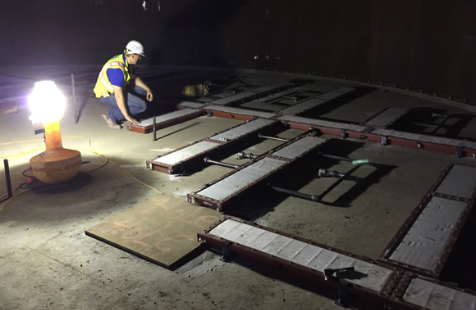 Man laying down air pad diffusers, air stones, and air slides