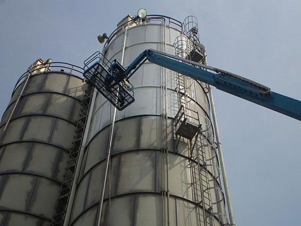 Man performing silo coating